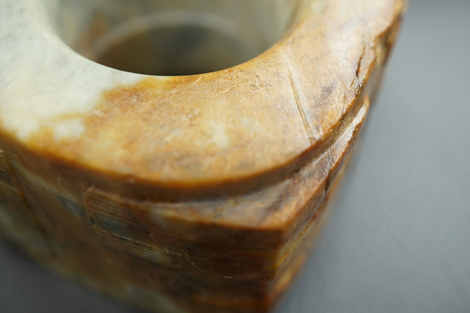 Four Chinese archaistic hardstone or burnt jade cong or cylinders